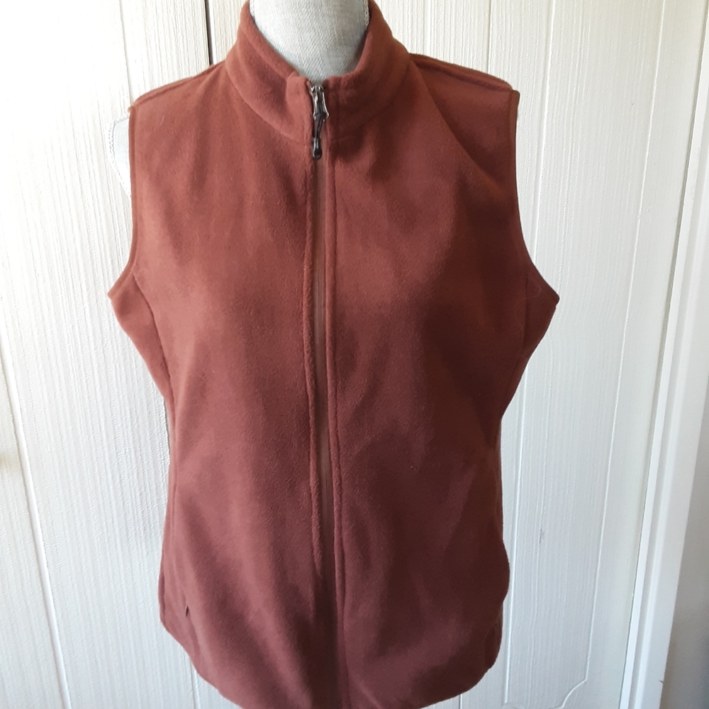 Womens sleeveless front zip vest.